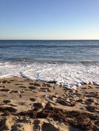 traces on sand at ocean serfline