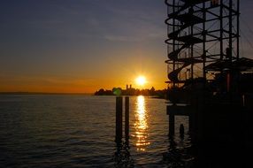 Panoramic view from shore to lake at sunset