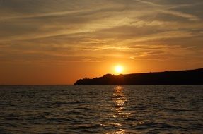 sunset reflecting in the sea water