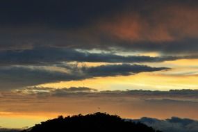 dark streaks of clouds in the sky