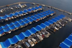 top view of blue canopies on the marina