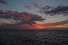 red clouds over the pacific