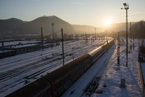 landscape of railways sunset over mountains winter season