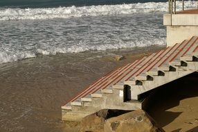 concrete stairs on the sand beach