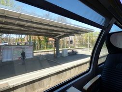 view of railroad platform from train