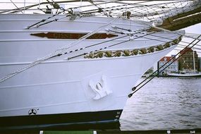 Close-up of the white and black ship on the ocean