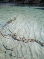 rope under water on the beach