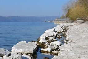 Blue lake constance water beach stones