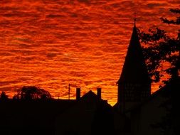 bright red sky over the church