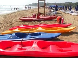 colorful paddle boats on beach, italy, sicily