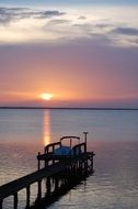 landscape of the boat on the pier at sunset