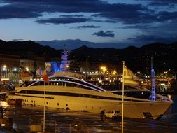 luxury megayacht in the port in the evening