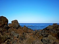 landscape of ocean behind the rocks