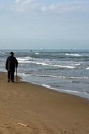 old man on a walk on the beach