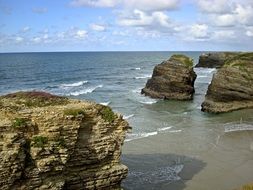 natural rocks on the sandy shore