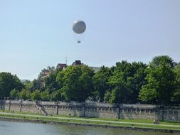 hot air balloon in the sky above the town