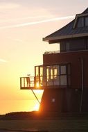 people on the balcony at sunset