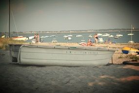 white boat on sand beach at sea, france