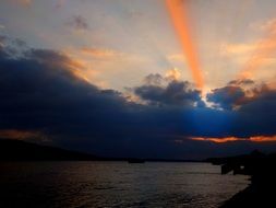 bright rays above the clouds in the evening sky