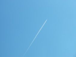 distant aircraft at blue sky