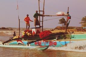 fishermen on a boat in the ocean