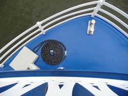 Black rope on a blue ship