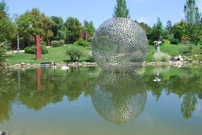 metal sculpture on the water
