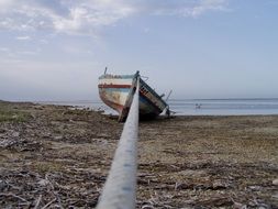 boat on a deserted beach close up