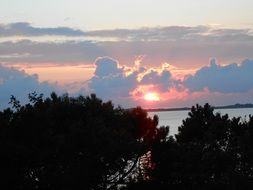 white and pink clouds at sunset