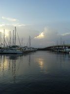 sailboats on water at dusk