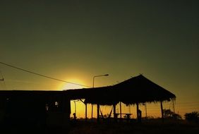 landscape of the summer cottage at the sunset