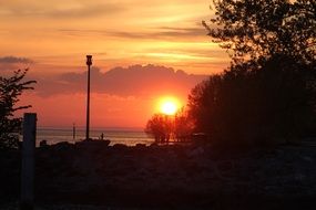 romantic sunset over dark silhouettes