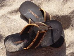 flip flop shoes on sand