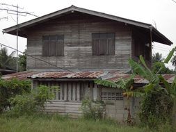 old wooden house among nature in Thailand