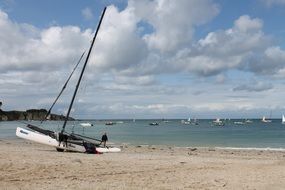 Sailing boat on an ocean beach