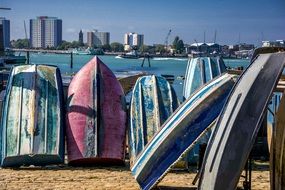 boat grounds on sea beach city aback
