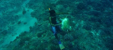 man in water in indonesia