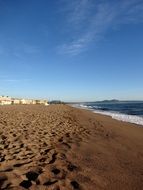 photo of wet sand on a summer beach