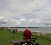 grandfather launching a kite