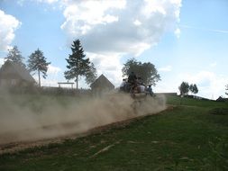 dust on the road from the tank