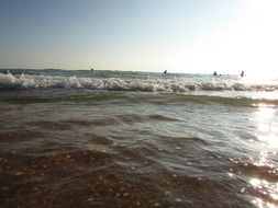 waves of the surf in the bright sun