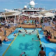 people swim in the pool on a cruise