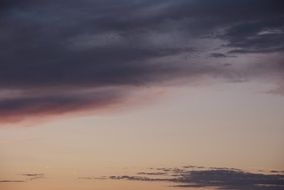 glow through the purple evening clouds