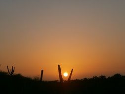 distant view of sun setting