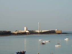 lighthouse and pier on the ocean