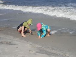 children play at baltic sea