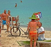 resting humans on a sand beach in summer