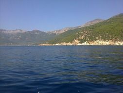 calm sea on the background of high mountains