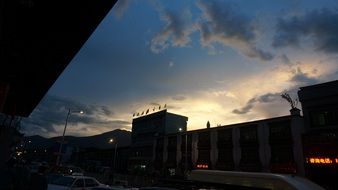 building silhouettes at dusk in tibet