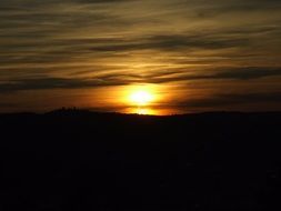 sunset view on the horizon beyond the mountain